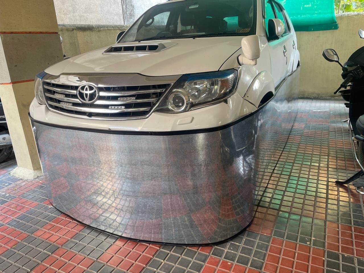 Car-lungi GI sheet barrier combined with silver car cover - complete rat and dust protection